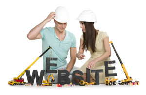 Website under construction: Friendly man and woman building webs